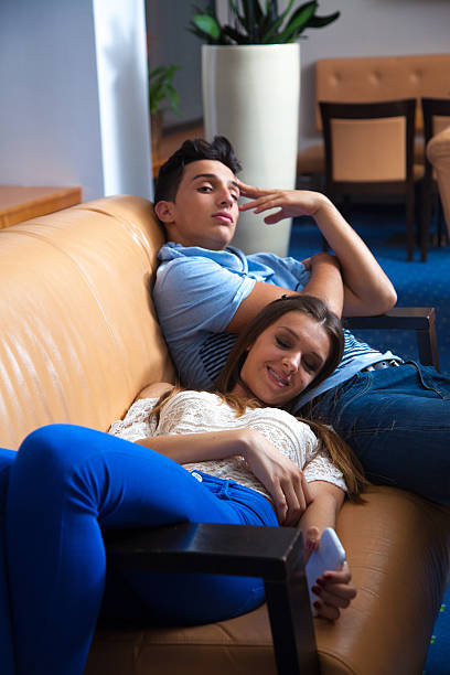 istock tired young couple on the couch 526470711
