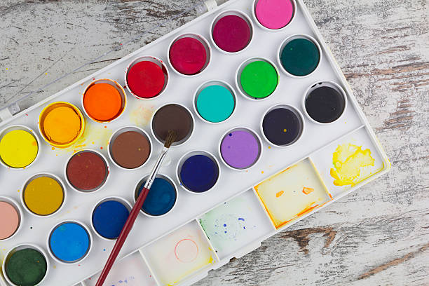 istock Watercolor palette with paintbrush 526470969