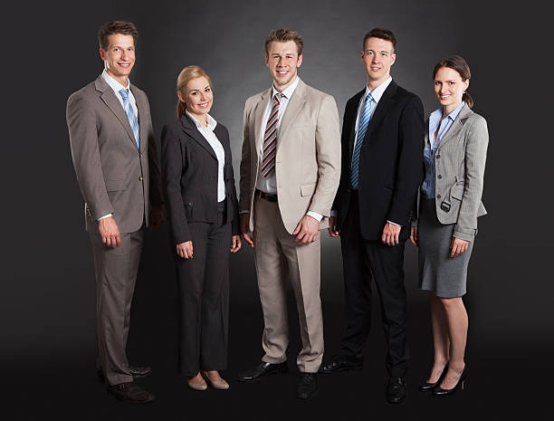 istock Confident Business Team Standing Arms Crossed 526471753