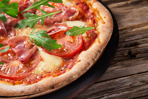 istock Delicious italian pizza served on wooden table 526471791