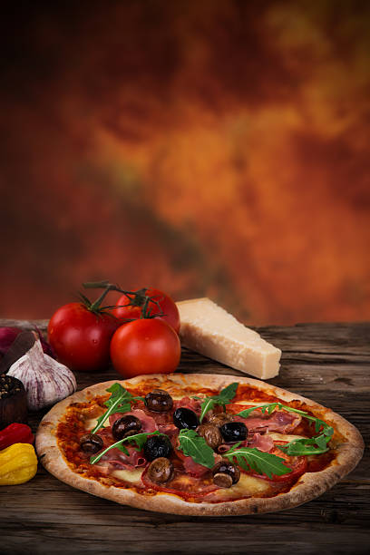 istock Delicious italian pizza served on wooden table 526471827