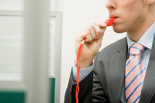 Man with Red Whistle in Office