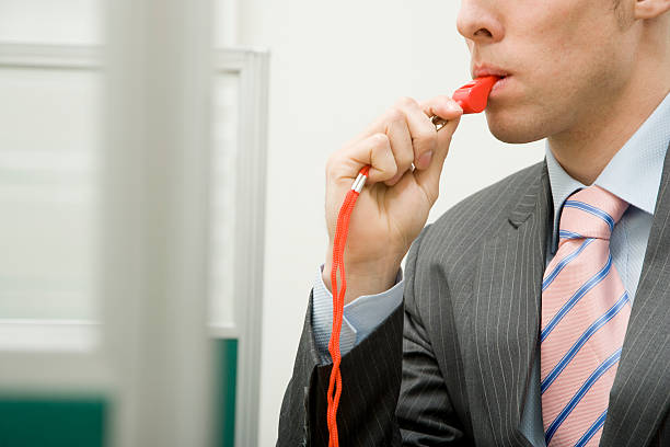 Man with Red Whistle in Office Man with Red Whistle in Office whistle stock pictures, royalty-free photos & images