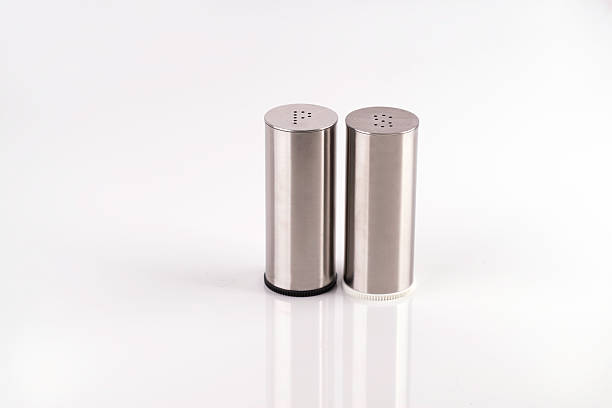 istock Salt and pepper shakers on a white table 526489933
