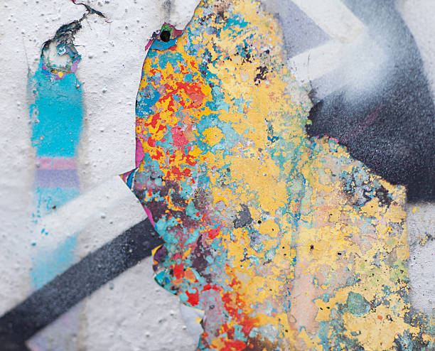 istock Wall with several layers of paints and holes on it 526490585