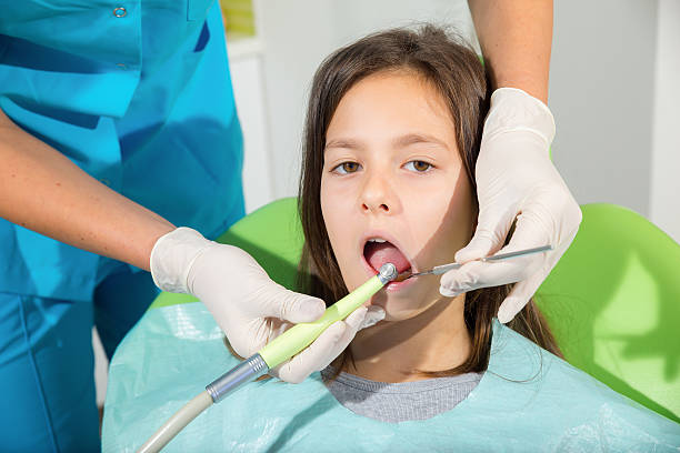 istock Little girl in dentist office 526491807
