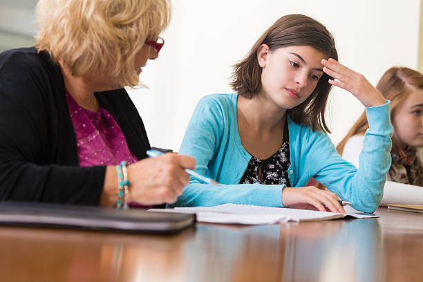 boring homework pictures Teacher talking to upset student during detention in school Teacher talking to upset student during detention in school boring homework twelve stock pictures, royalty-free photos & images