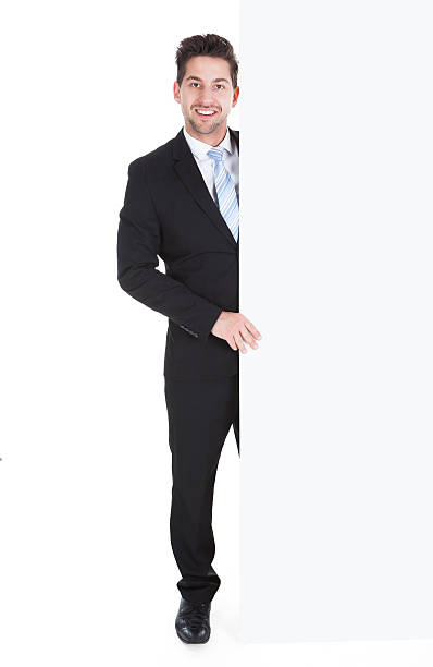 istock Confident Businessman Showing Billboard 526494001