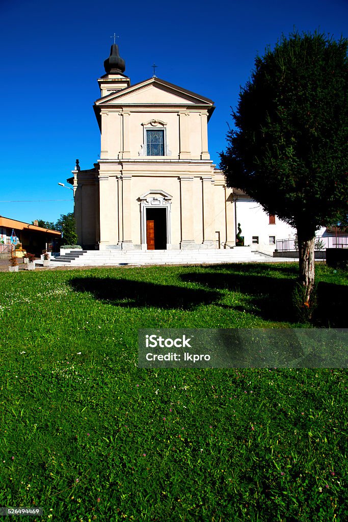 casorate sempione  al campo in  the old   grass in  the casorate sempioneal campo old   church  closed brick tower sidewalk italy  lombardy Architectural Column Stock Photo