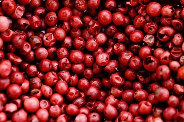 A background of pink peppercorns - macro photo