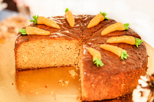 Carrot cake decorated with carrots on the top