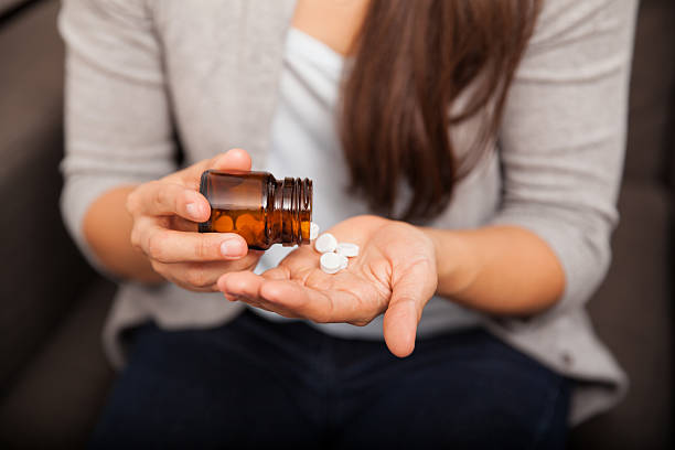 istock Woman taking her medication 526495361