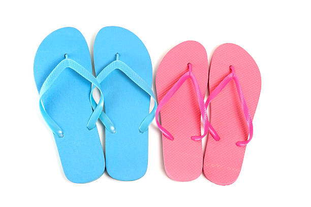 istock male and female flip flops over white 526495425
