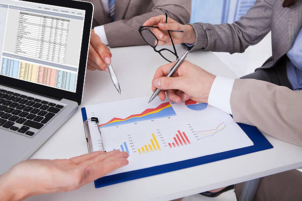 istock Business People Discussing Over Graph In Office 526495713
