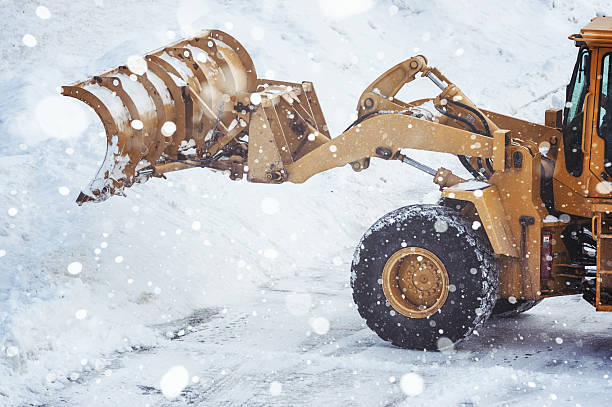 istock Clearing Parking Lot of Snow 526496083