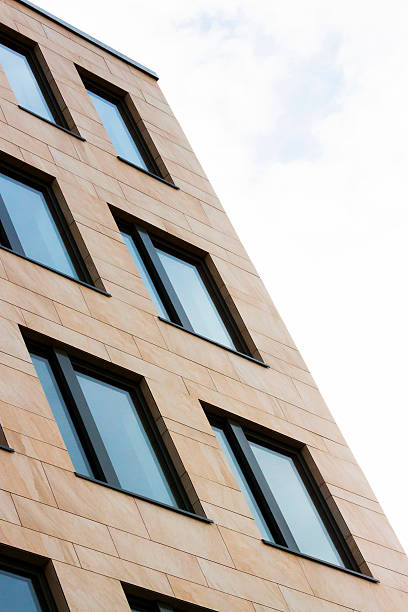 istock Closeup office building with brick wall and windows, copy spcae 526496389