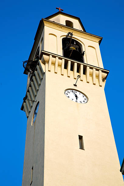istock olgiate    wall  and tower bell sunny day 526504135
