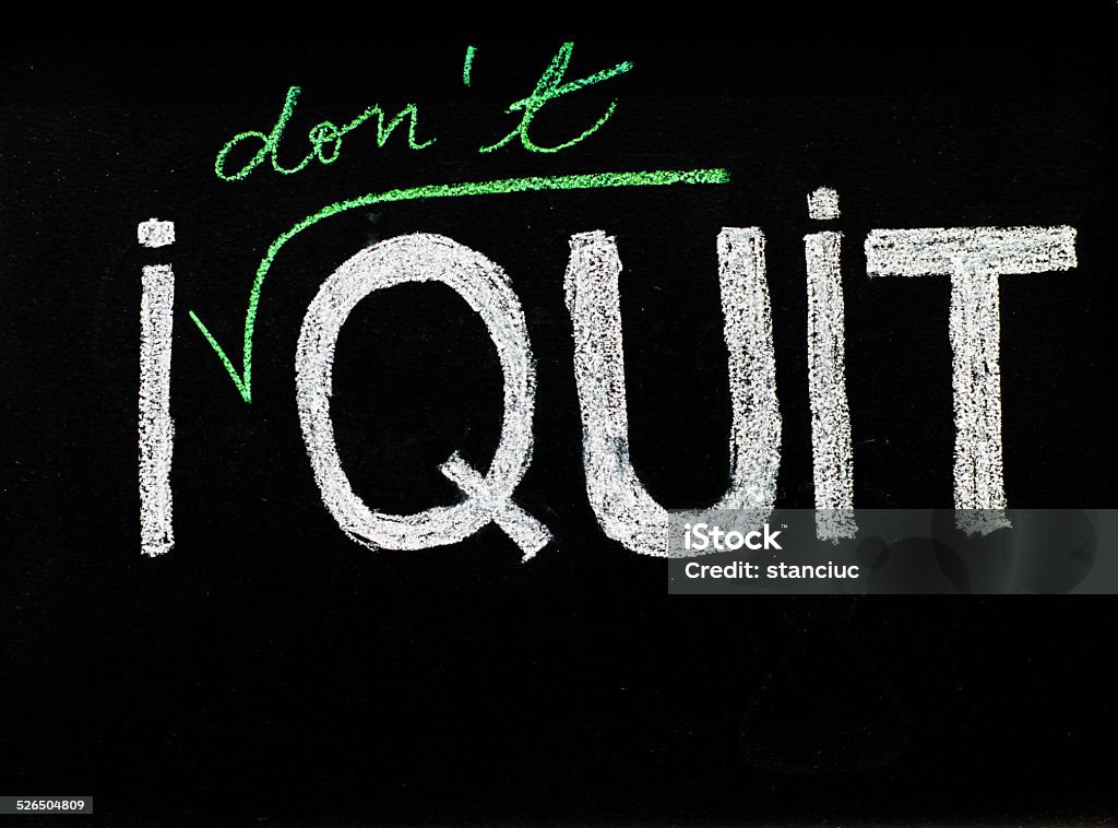 I don't quit message, handwriting with chalk on blackboard I don't quit message, handwriting with chalk on blackboard, lifestyle change concept Announcement Message Stock Photo