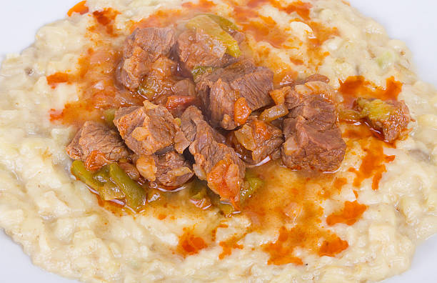 Sultans Delight Close Up Image of Sultans Delight from Ottoman Cuisine. Lamb Stew Served on a Bed of Aubergine Purée hunkar begendi stock pictures, royalty-free photos & images