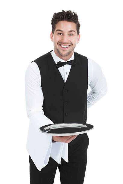 istock Smiling Young Waiter Holding Empty Serving Tray 526505723