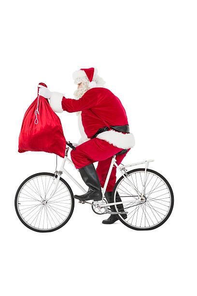 istock Santa cycling and holding his sack 526506621