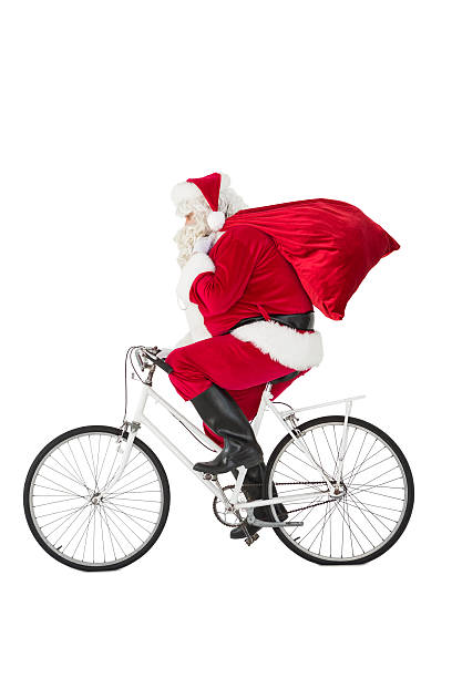 istock Santa claus delivering gifts with bicycle 526506625
