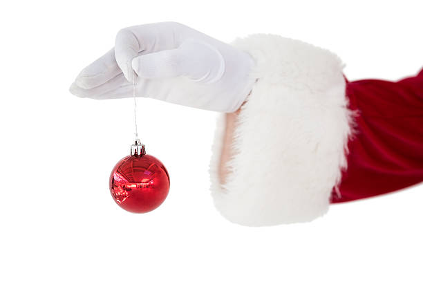 istock Santa claus holding red bauble 526506721