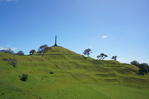 November 23, 2014  One Tree Hill is a volcanic peak in Auckland, New Zealand. It is an important memorial place for both Maori and other New Zealanders. The suburb around the base of the hill is also called One Tree Hill; it is surrounded by the suburbs of Royal Oak to the west, and clockwise, Epsom, Greenlane, Oranga, and Onehunga. The summit provides views across the Auckland area, and allows visitors to see both of Auckland's harbours.
