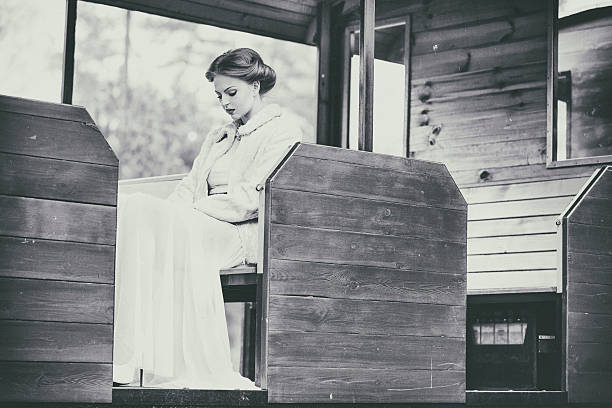 istock Young lady in a vintage train wagon 526509333