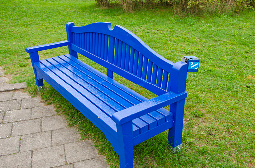 blue wooden seat bench in summer resort park