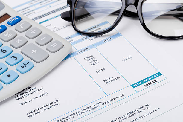 istock Studio shot of calculator and glasses over some receipt 526531171
