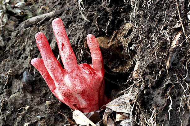 istock hand creeping out of the ground 526531355