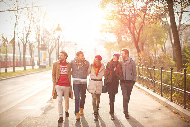 istock Friends walking outdoors in autumn city. 526532817