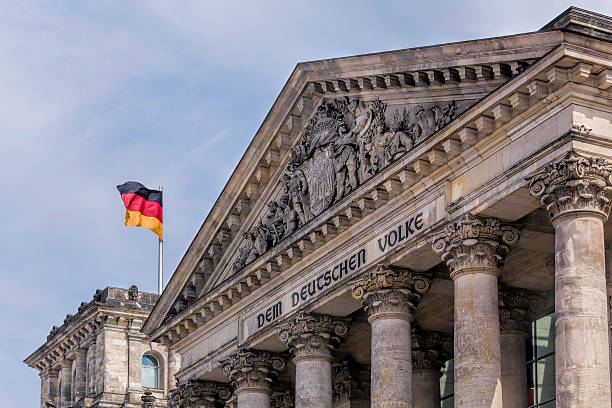 istock The Reichstag building with German flag in Berlin, Germany 526534183