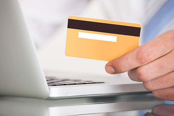 istock Man Shopping With Credit Card And Laptop 526534439