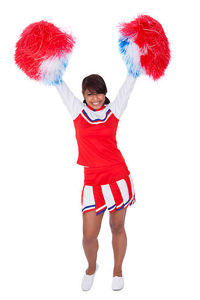 istock Smiling beautiful cheerleader with pompoms 526535017