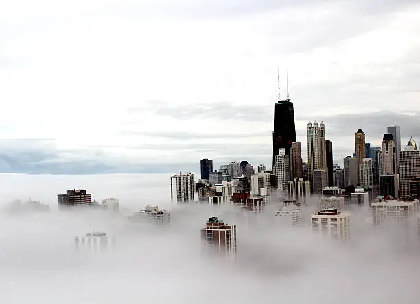 Photo of Chicago city buildings in the clouds