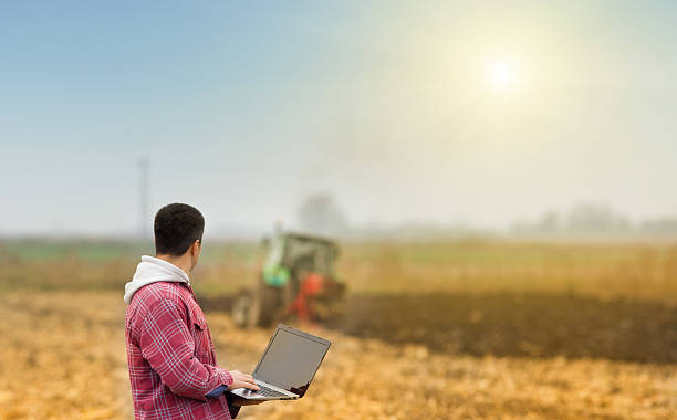 istock Man with laptop in the field 526537935