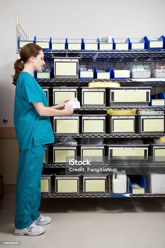 Nurse in Intensive Care Unit Supply Room Storage Room Stock Photo