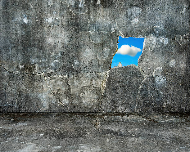 istock nature sky view through hole on grey grunge concrete wall 526538581