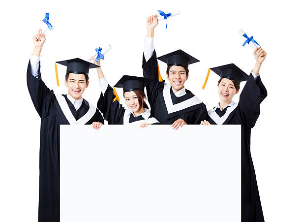 istock young Group of graduate students presenting empty banner 526538588