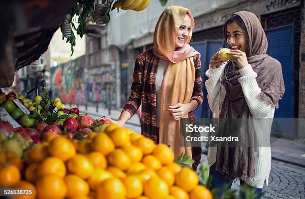 Women Buying Fruits From The Street Vendor Stock Photo - Download Image Now - Market - Retail Space, Istanbul, West Asian Ethnicity