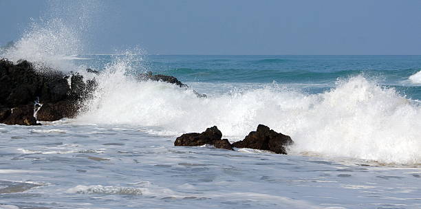 istock Morning surf breaks on rocks of Puako beach - 2 526539326