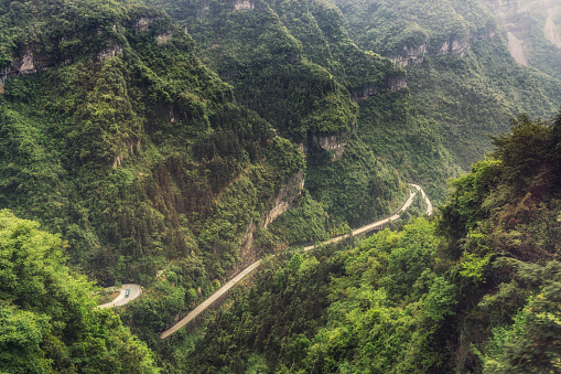 the view of tianmen mountain winding road from the longest cable car. taken in zhangjiajie, hunan province, china