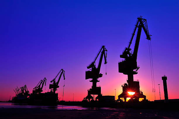 istock Port crane bridge and bulk carrier 526541336