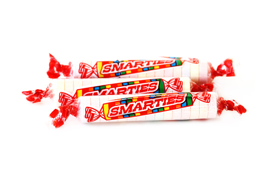 West Palm Beach, USA - May 1, 2016: Smarties Candy Rolls, a product of Smarties Candy Company. Closeup product shot on a white background. 