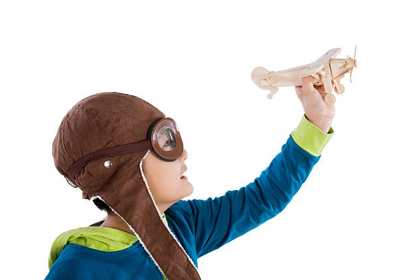istock Asian Chinese Boy Playing with Wooden Airplane 526543248