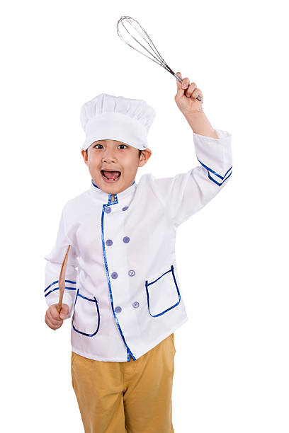 istock Asian Chinese Boy in White Chef Uniform Holding Baking Tools 526543408