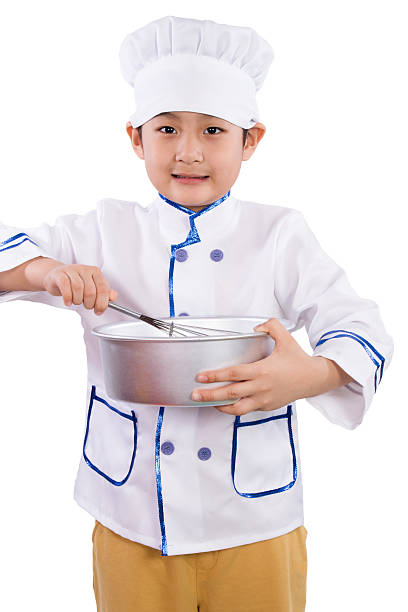 istock Asian Chinese Boy in white chef uniform Baking Cookies 526543440