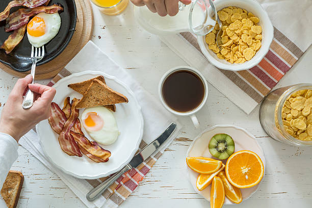 istock Family eating american breakfast 526544078